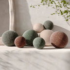 Textured woven spherical throw pillow (9-14 inches)